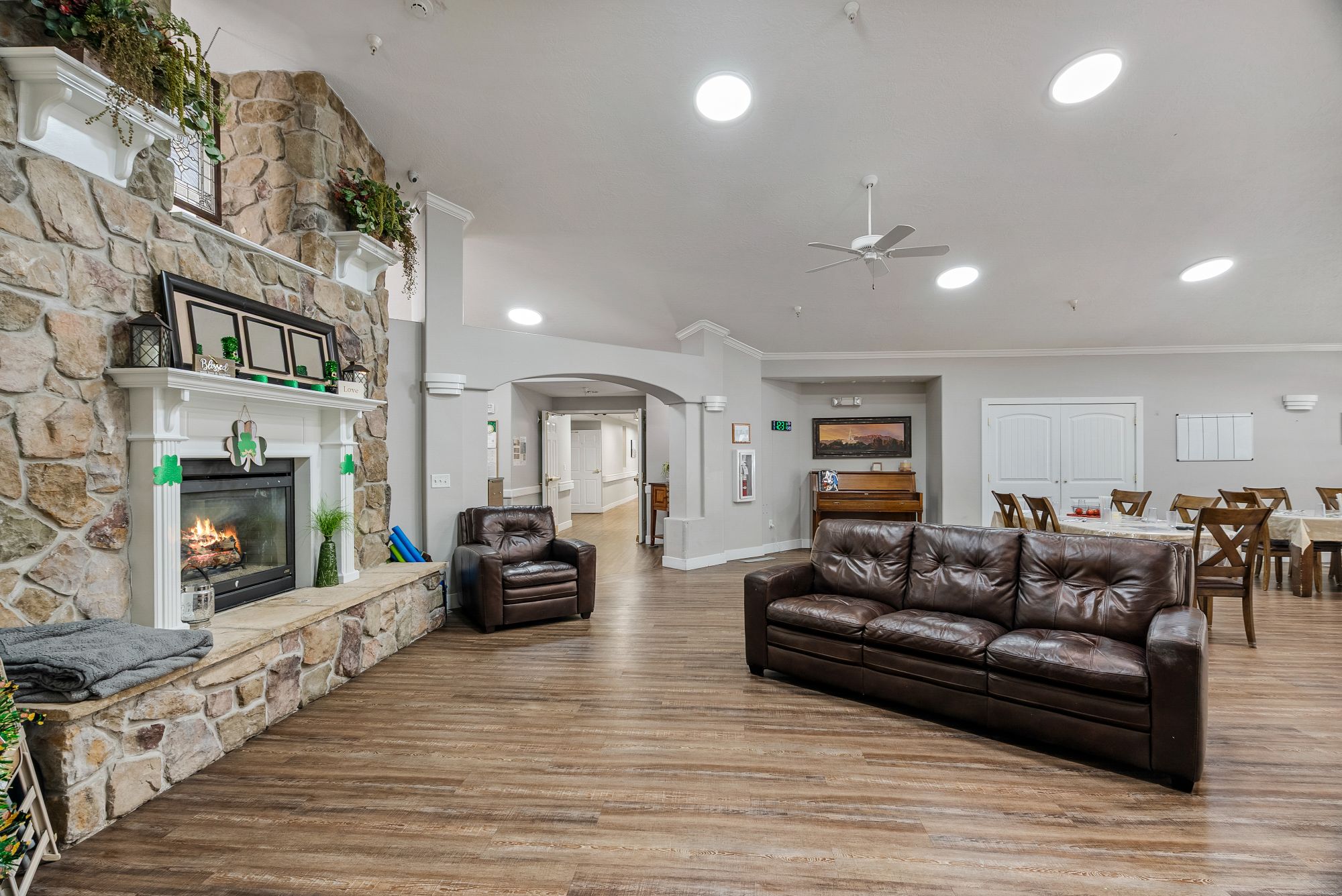 Cozy fireside lounge with leather seating and dining tables