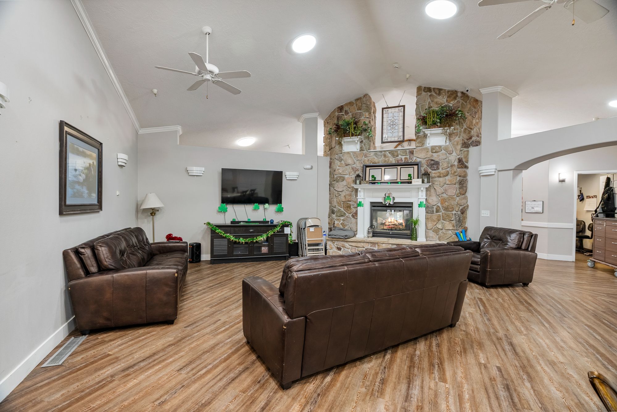 Comfortable common area with leather sofas and stone accents