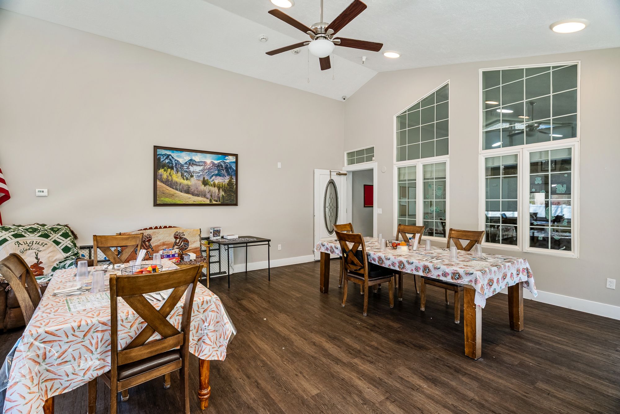 Home-style dining room with framed mountain art